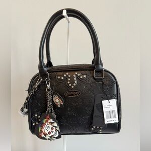 Ed Hardy Black Satchel with Embossed Skull Motif and Charm Accents